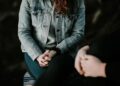 https://unsplash.com/photos/woman-in-denim-jacket-sitting-F9DFuJoS9EU